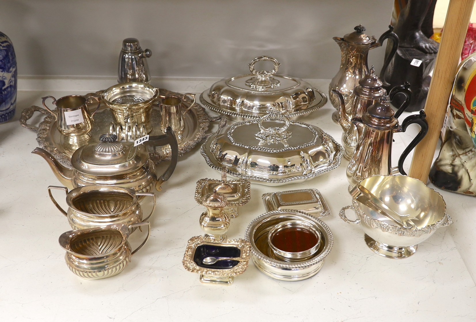 A large quantity of plated wares including two entree dishes and covers, a three-piece tea set etc.